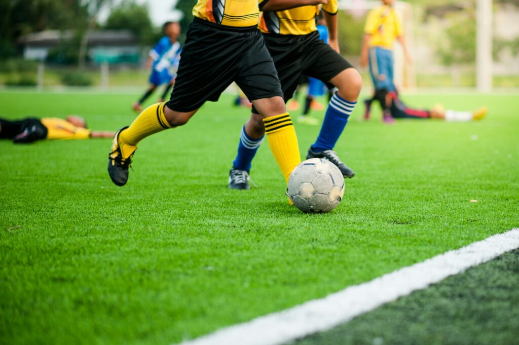 Soccer Football Training Session for Kids. Boys Training Football on the Pitch. Soccer Stadium in th